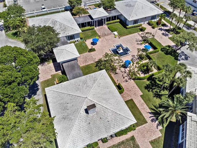 an aerial view of a house with a garden