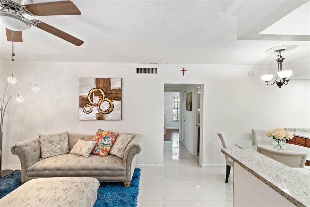 2151 Northeast 68th Street Fort Lauderdale, FL 33308 - Photo 6 of 45 a living room with furniture and a table