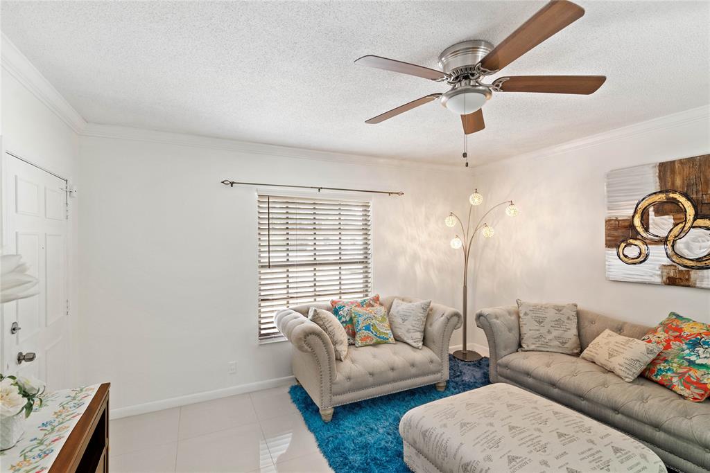 2151 Northeast 68th Street Fort Lauderdale, FL 33308 - Photo 7 of 45 a living room with furniture and a window