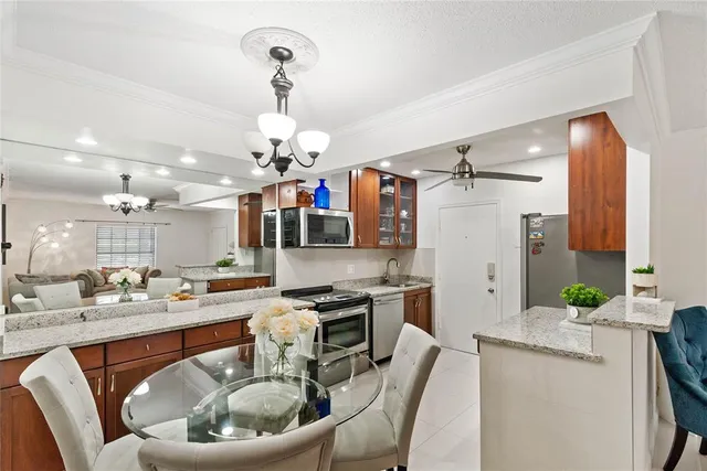 a kitchen with a table and chairs