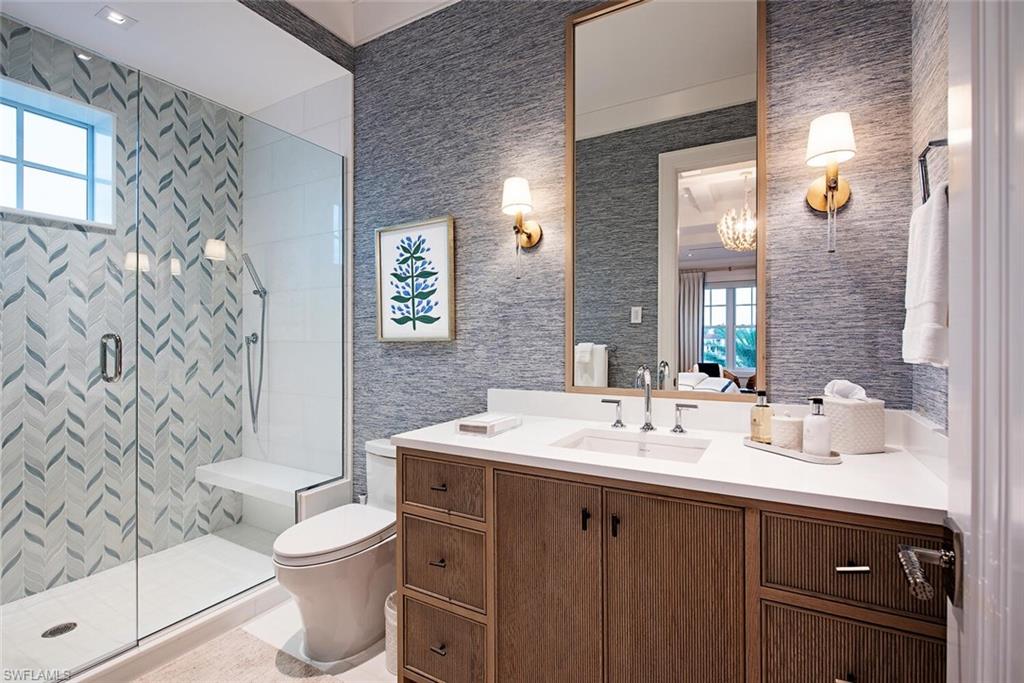 4115 Cutlass Lane Naples, FL 34102 - Photo 24 of 44 a bathroom with a sink toilet and shower