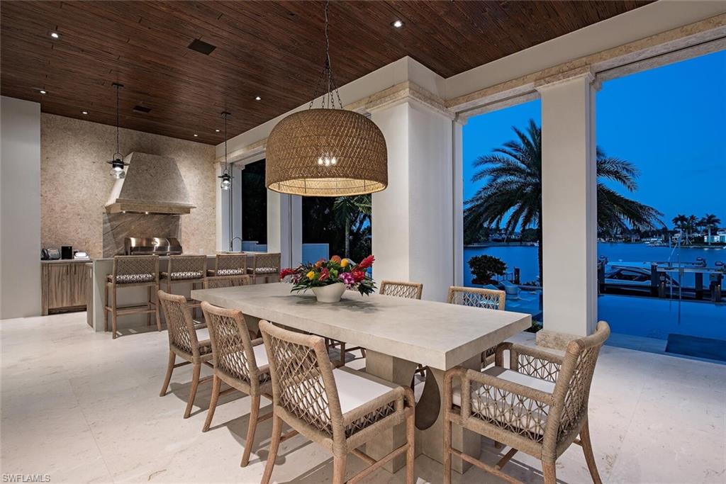 4115 Cutlass Lane Naples, FL 34102 - Photo 27 of 44 a view of a dining room with furniture