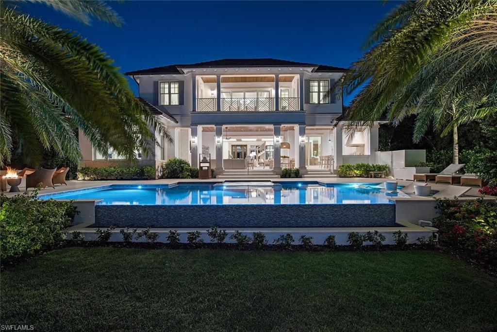 4115 Cutlass Lane Naples, FL 34102 - Photo 34 of 44 a view of a house with a swimming pool