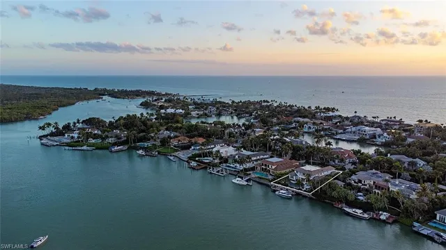 an aerial view of multiple house with ocean view