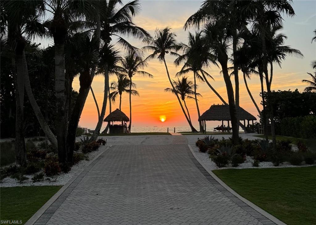 4115 Cutlass Lane Naples, FL 34102 - Photo 44 of 44 a backyard of a house with lots of green space