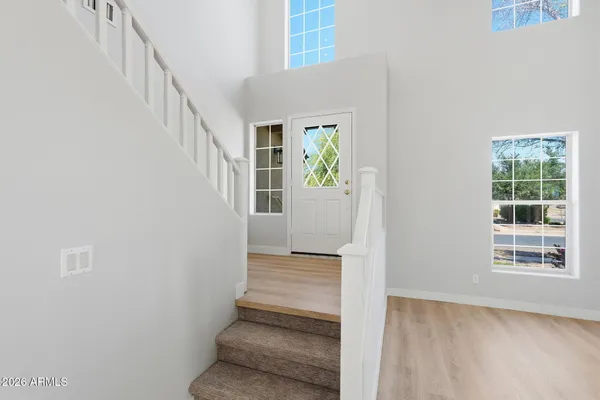 a view of entryway with window and wooden floor