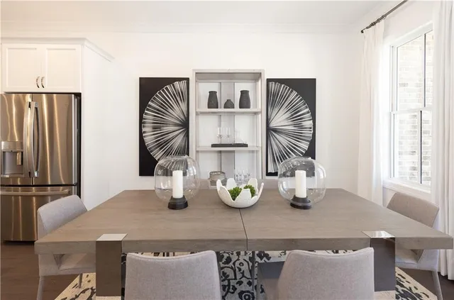 a kitchen with a table and chairs