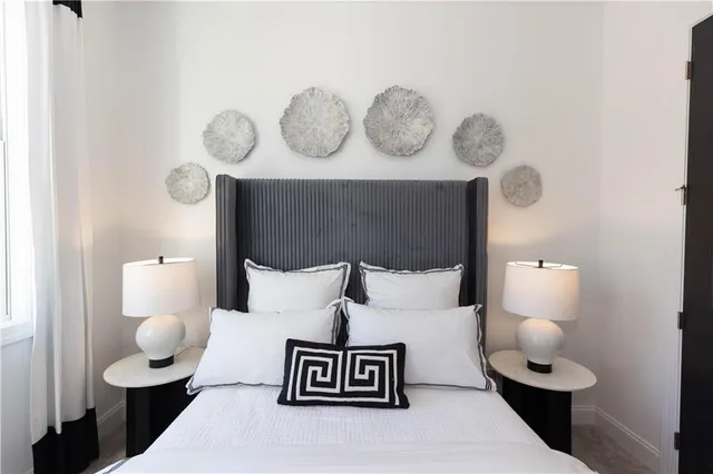 a bedroom with a bed and bathroom