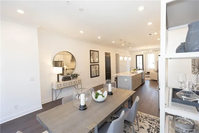 a living room with granite countertop kitchen island and stainless steel appliances