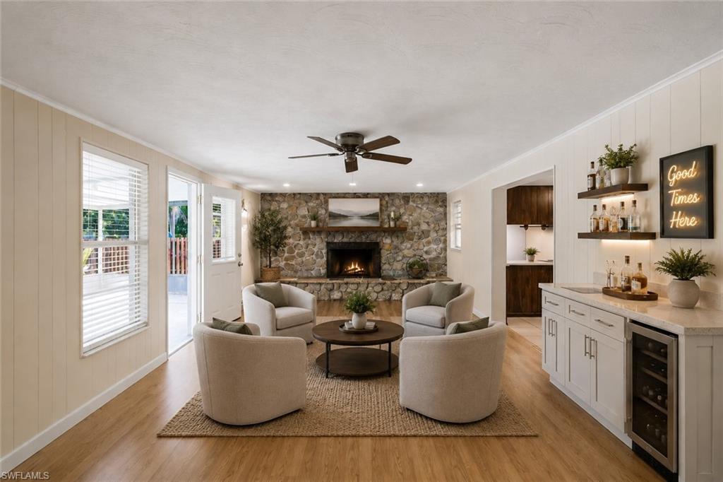 5290 Cypress Lane Naples, FL 34113 - Photo 6 of 39 a living room with furniture fireplace and window