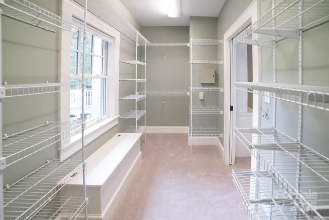 a view of an empty room with a glass door