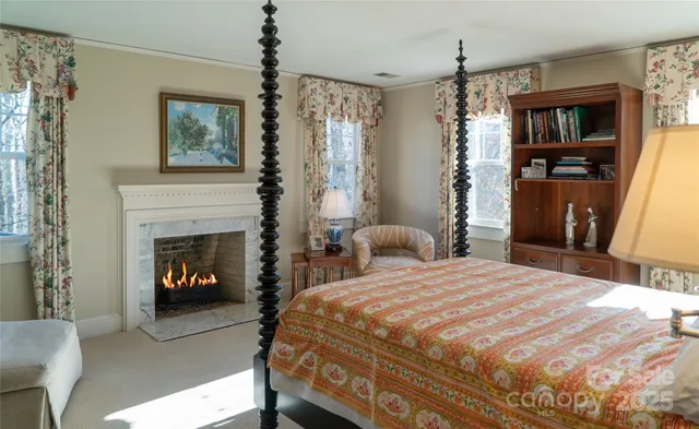 a bathroom with double vanity and a mirror