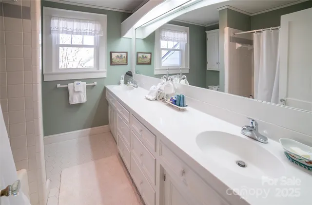 a kitchen with a sink a refrigerator and cabinets