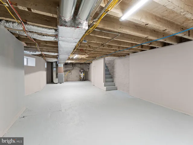 a view of empty room with wooden walls