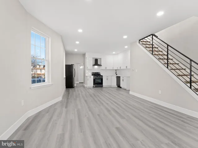 a view of a kitchen with a sink and a fireplace