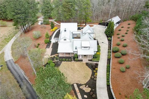 an aerial view of residential houses with outdoor space