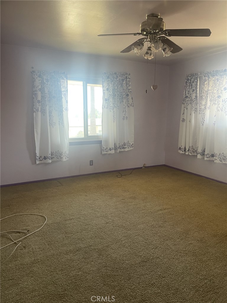 319 Tocino Drive Duarte, CA 91010 - Photo 11 of 23 en empty room with windows and fan