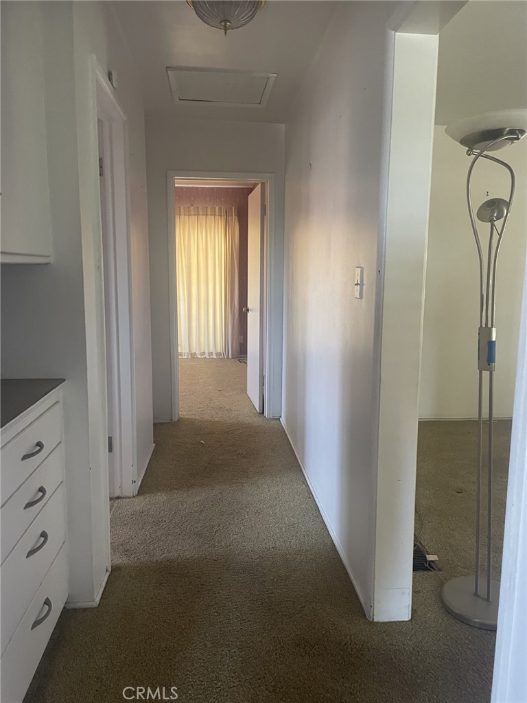 319 Tocino Drive Duarte, CA 91010 - Photo 13 of 23 a view of a hallway with closet and wooden floor