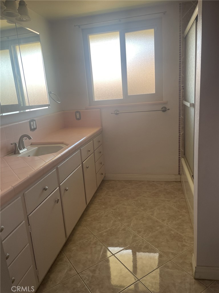 319 Tocino Drive Duarte, CA 91010 - Photo 14 of 23 a bathroom with a sink a toilet and mirror