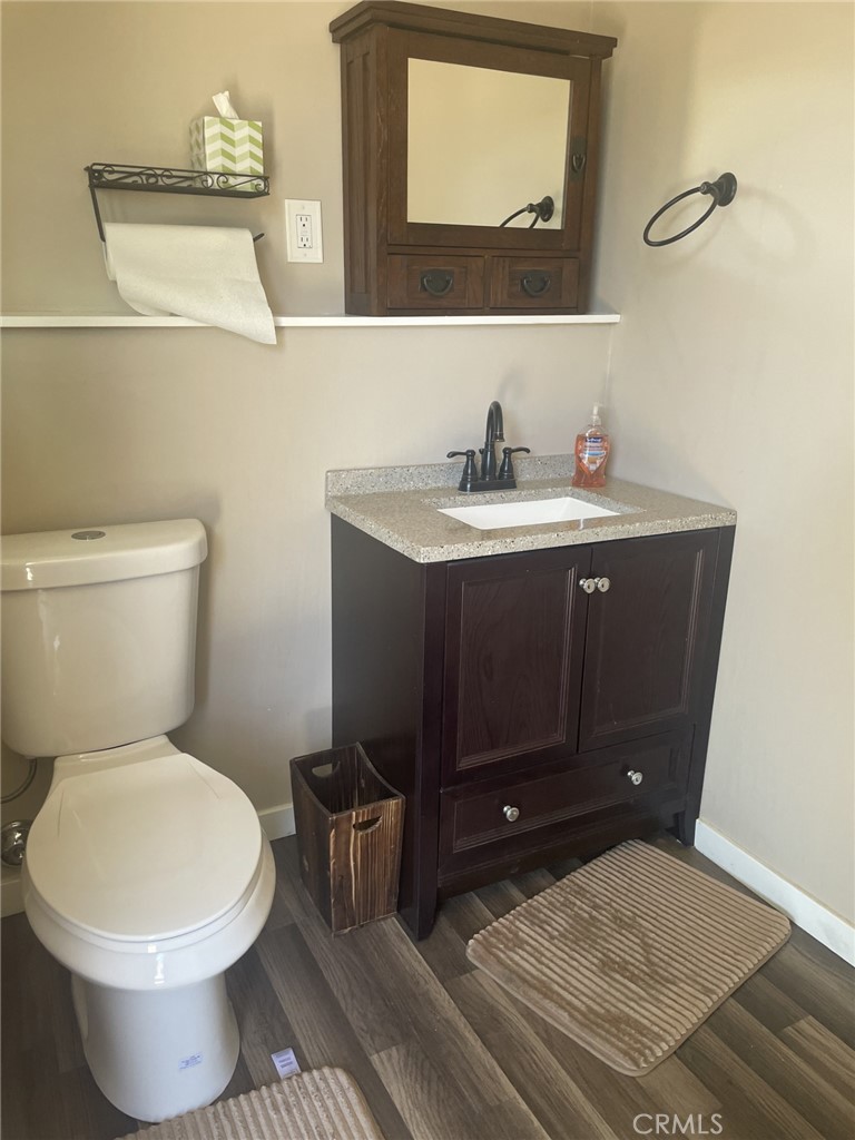 319 Tocino Drive Duarte, CA 91010 - Photo 17 of 23 a bathroom with a toilet sink and mirror