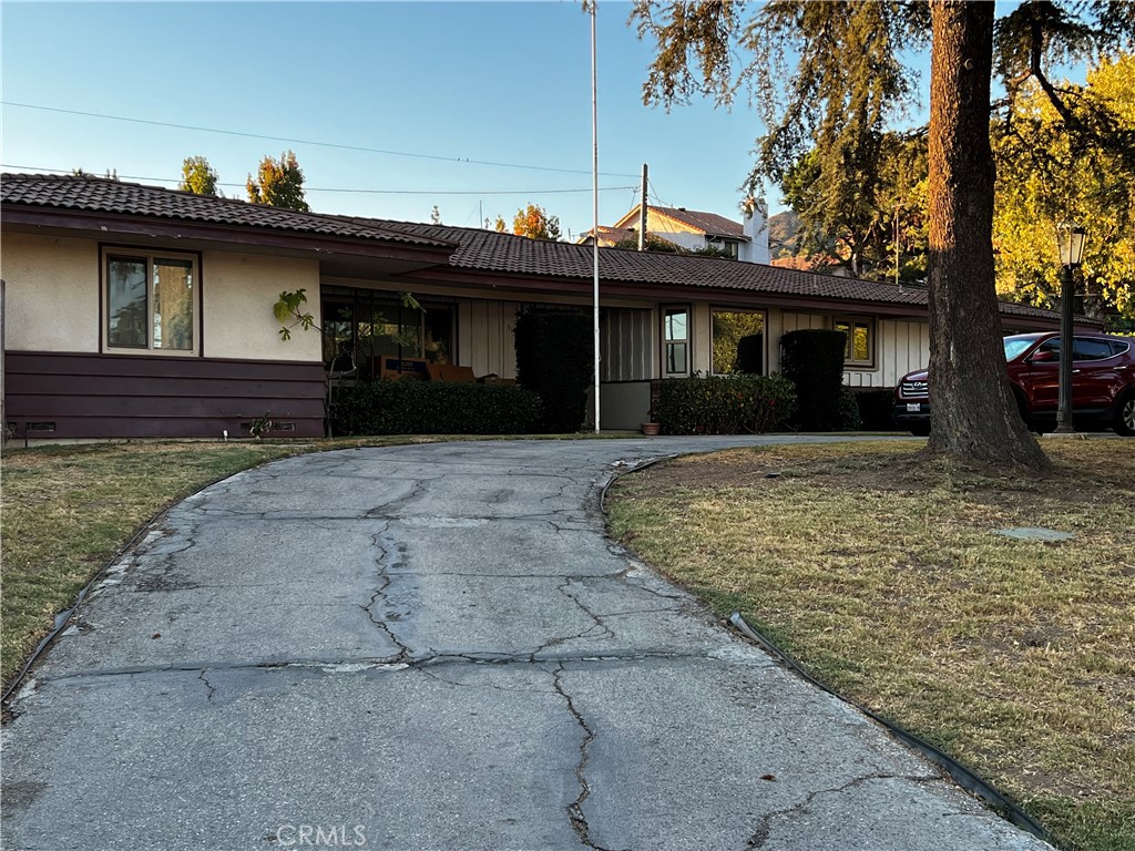 319 Tocino Drive Duarte, CA 91010 - Photo 2 of 23 a front view of a house with a garden