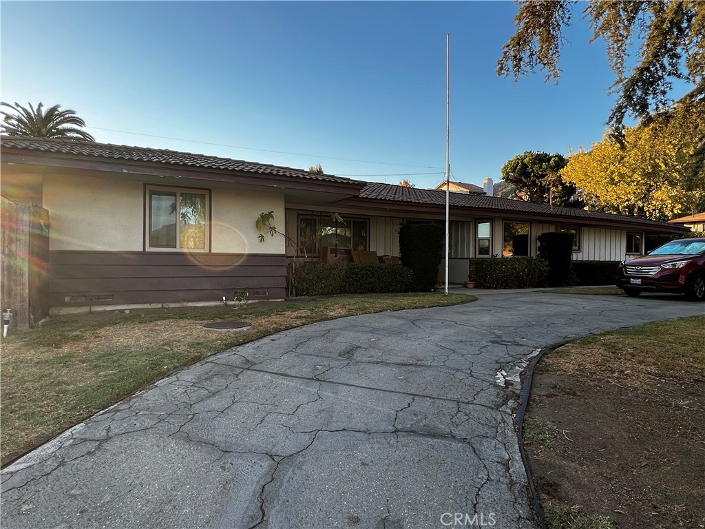 319 Tocino Drive Duarte, CA 91010 - Photo 5 of 23 a front view of a house with a yard and garage