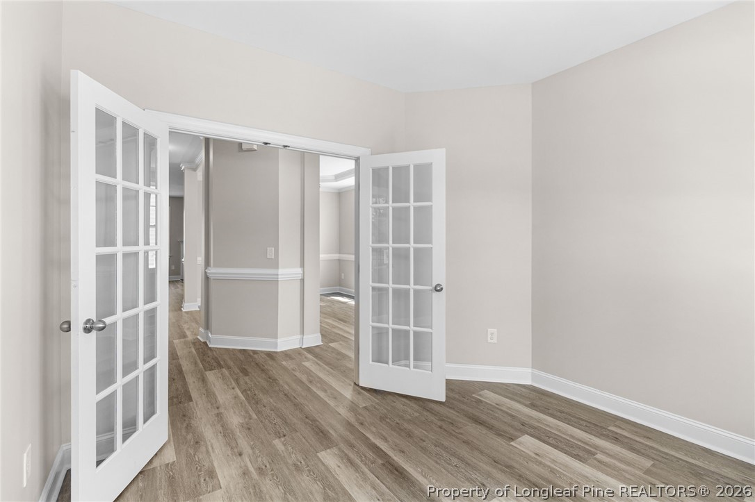 50 Huzzas Circle Cameron, NC 28326 - Photo 6 of 39 an empty room with wooden floor and windows