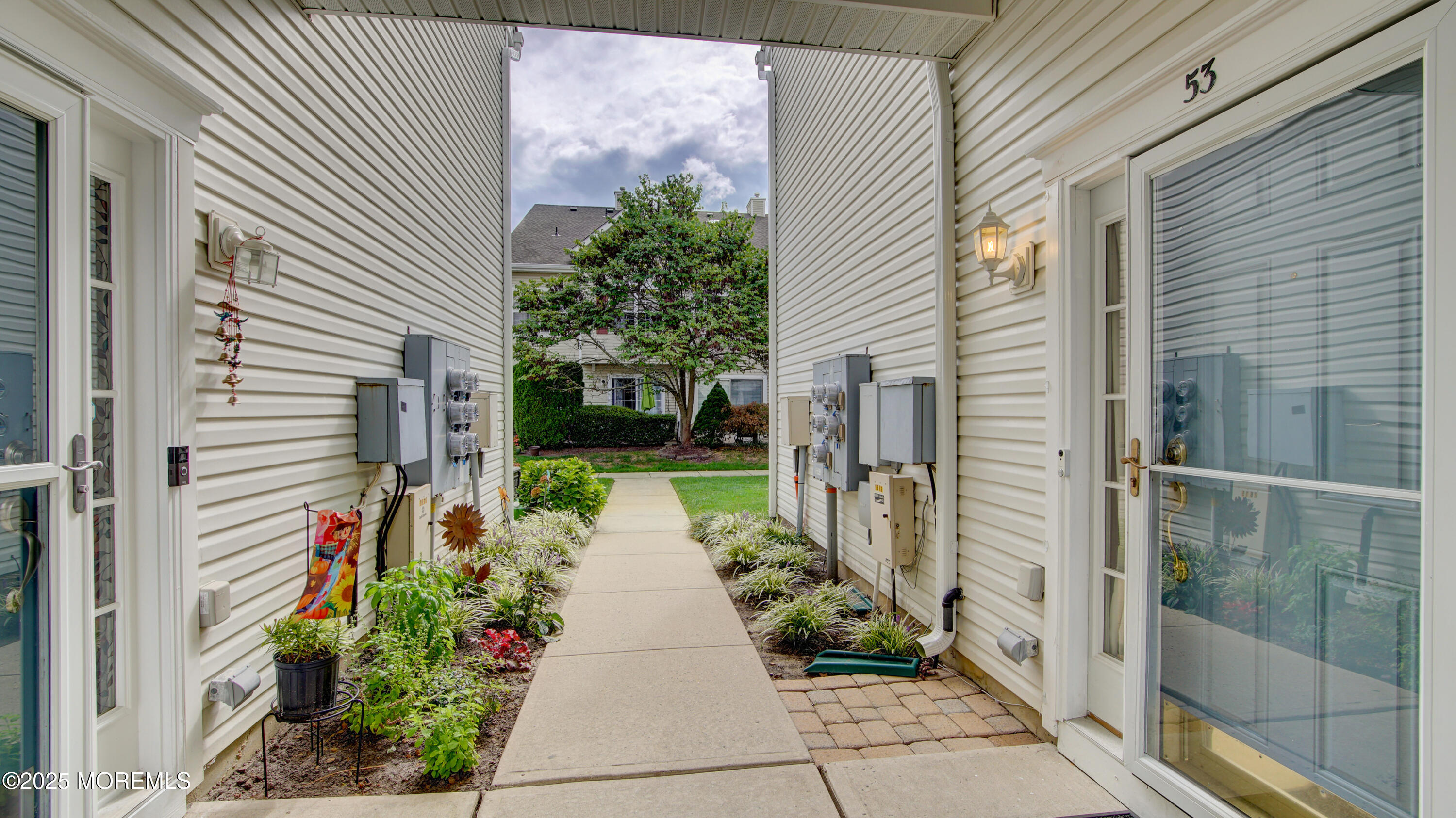53 Winged Foot Court Howell, NJ 07731 - Photo 1 of 28 a front view of a house with a porch