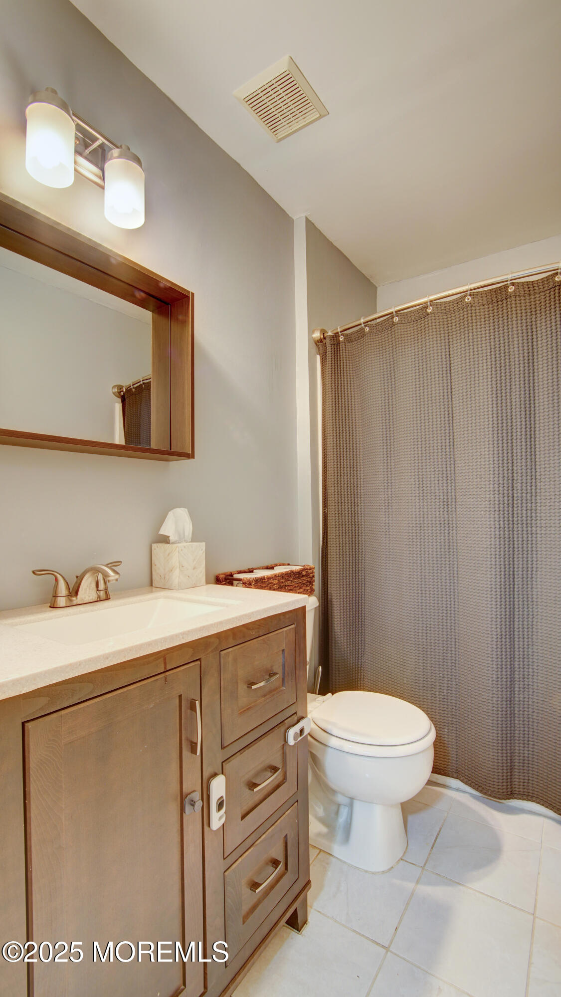 53 Winged Foot Court Howell, NJ 07731 - Photo 13 of 28 a bathroom with a granite countertop toilet sink and mirror