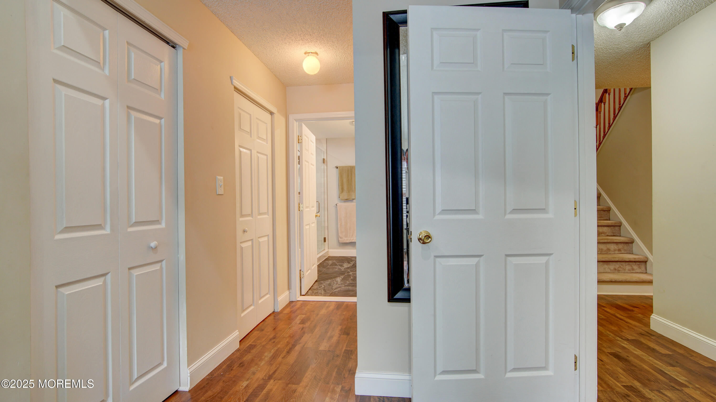 53 Winged Foot Court Howell, NJ 07731 - Photo 18 of 28 a view of a hallway with wooden floor and staircase
