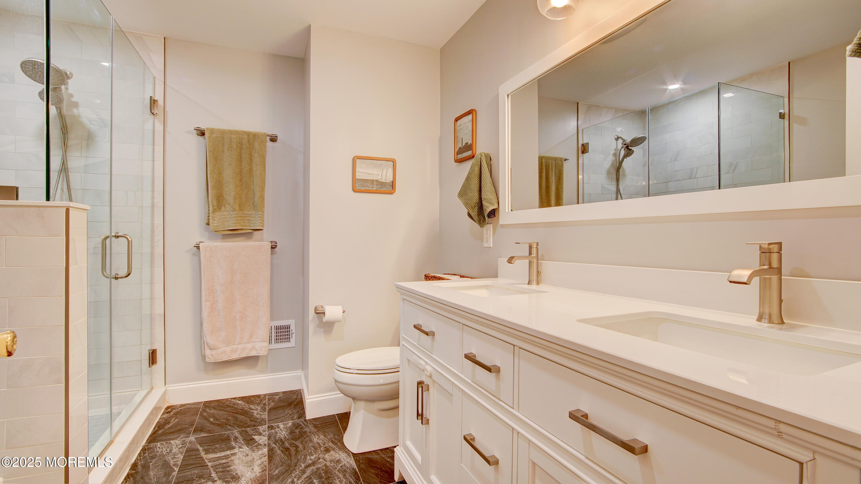 53 Winged Foot Court Howell, NJ 07731 - Photo 19 of 28 a bathroom with a sink and a mirror