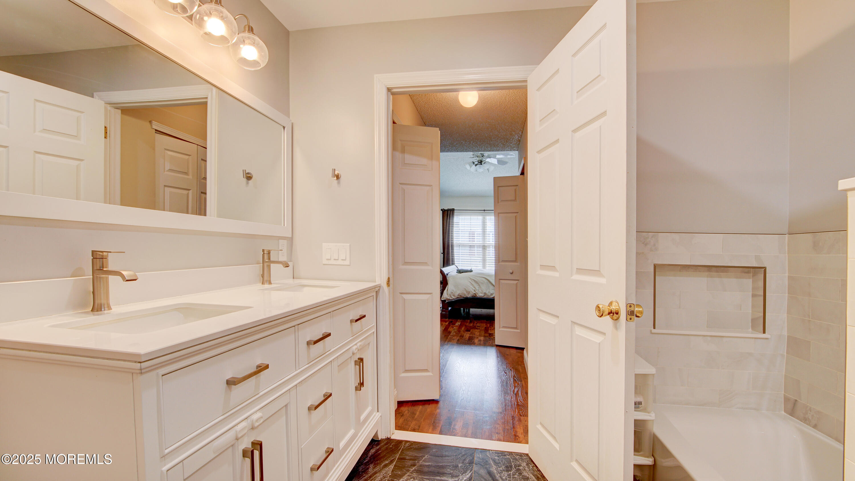 53 Winged Foot Court Howell, NJ 07731 - Photo 20 of 28 a bathroom with a sink a toilet and shower