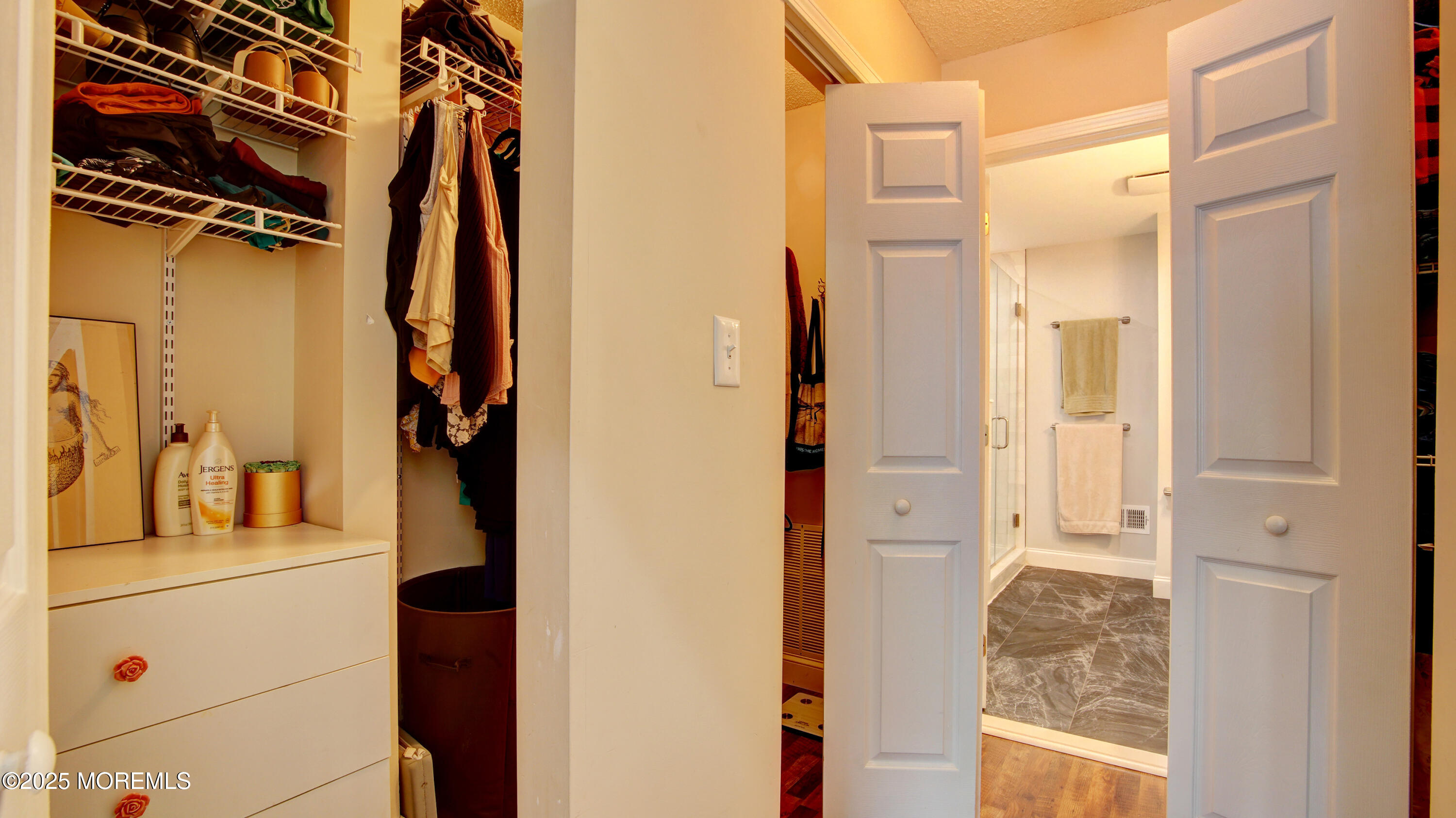 53 Winged Foot Court Howell, NJ 07731 - Photo 21 of 28 a view of walk in closet with clothes and shoes