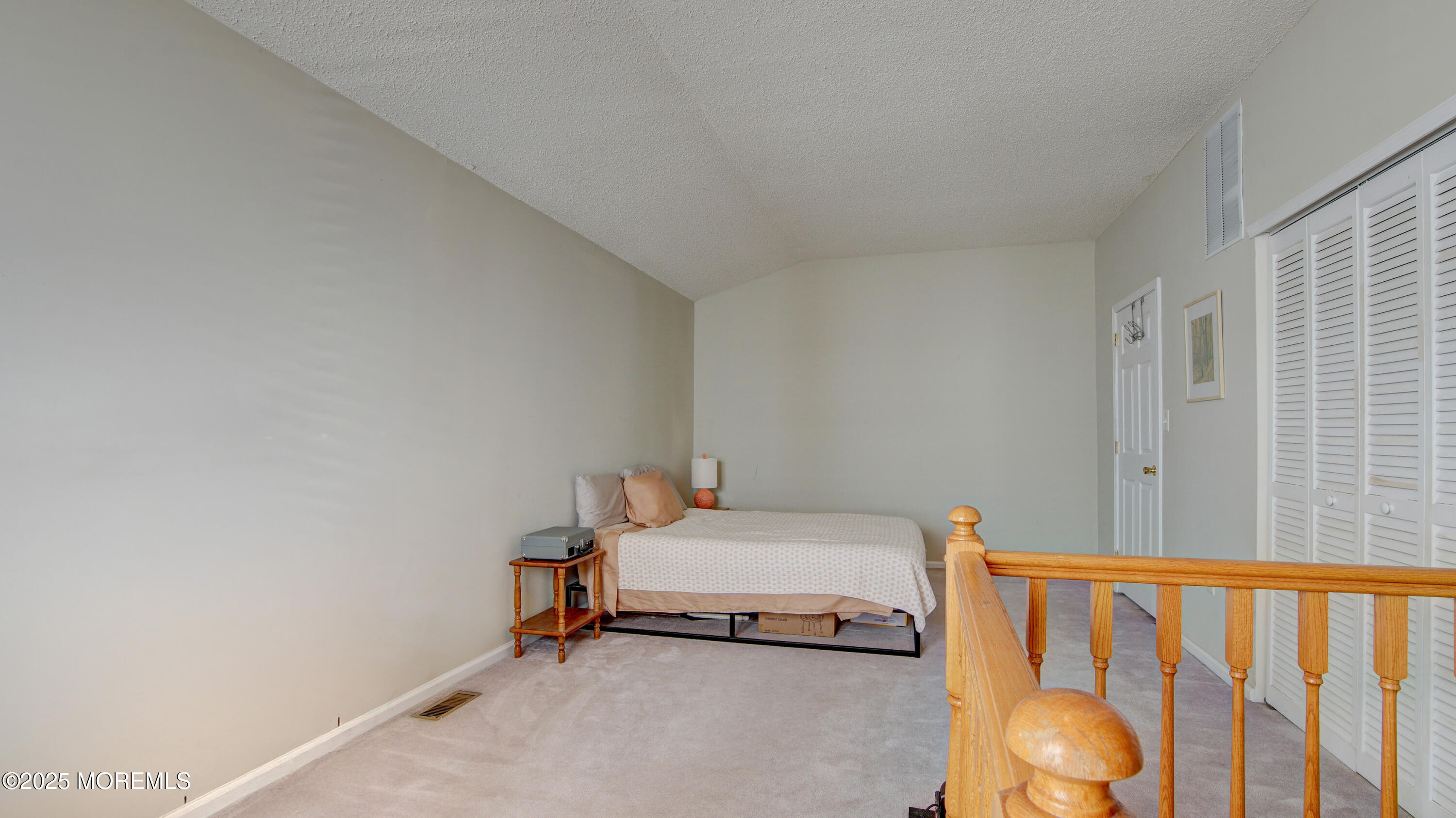 53 Winged Foot Court Howell, NJ 07731 - Photo 23 of 28 a bedroom with a bed and wooden floor