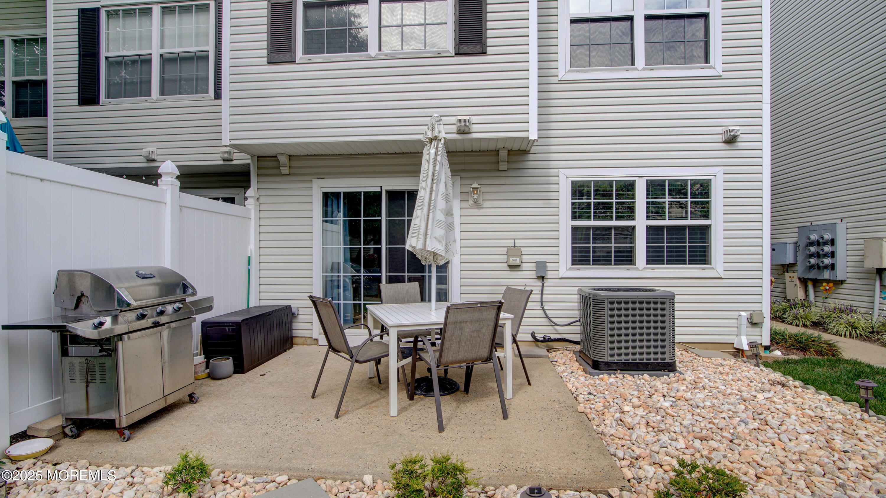 53 Winged Foot Court Howell, NJ 07731 - Photo 26 of 28 a view of a house with a patio and a yard