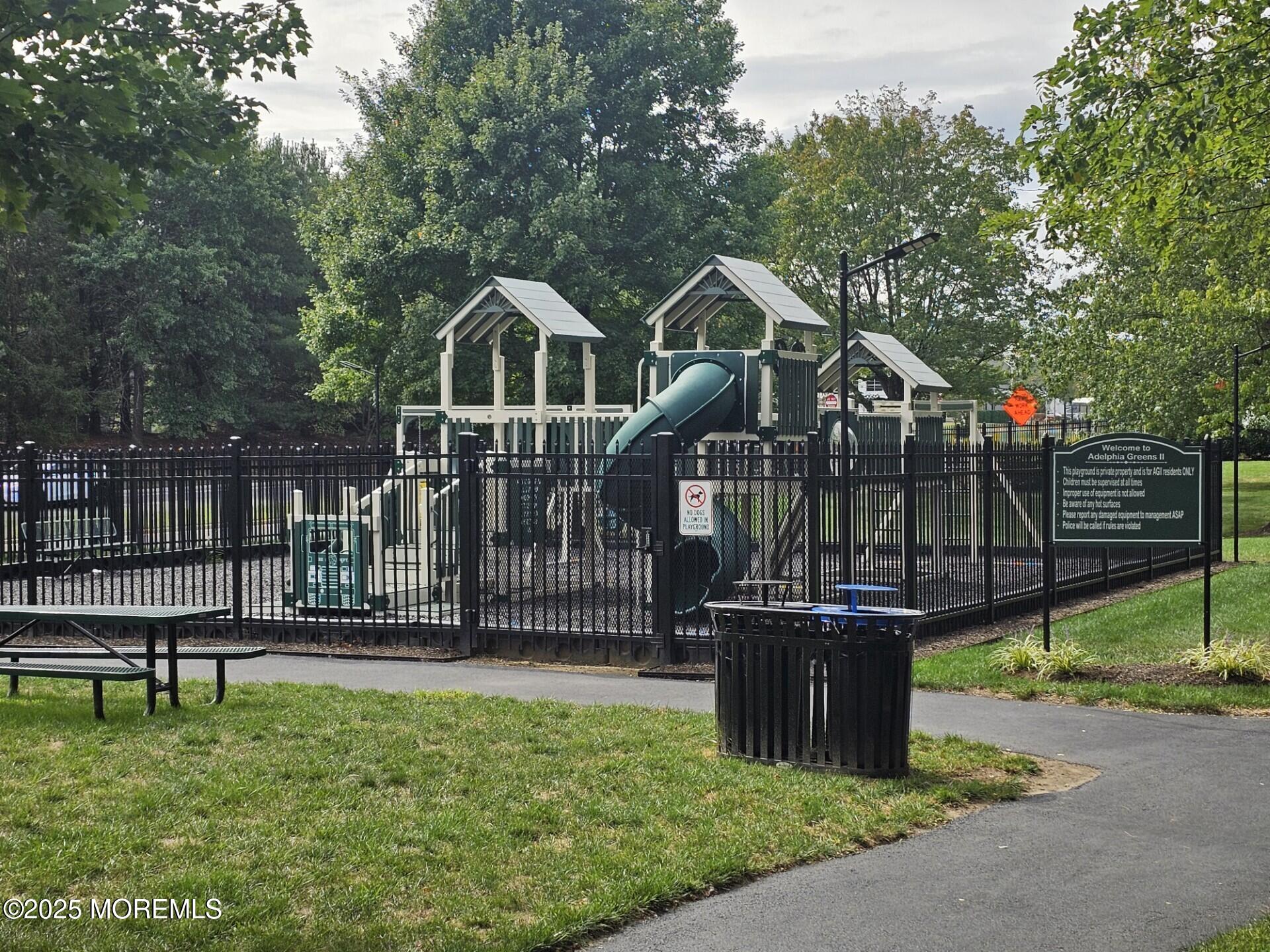 53 Winged Foot Court Howell, NJ 07731 - Photo 27 of 28 a front view of a house with wooden fence