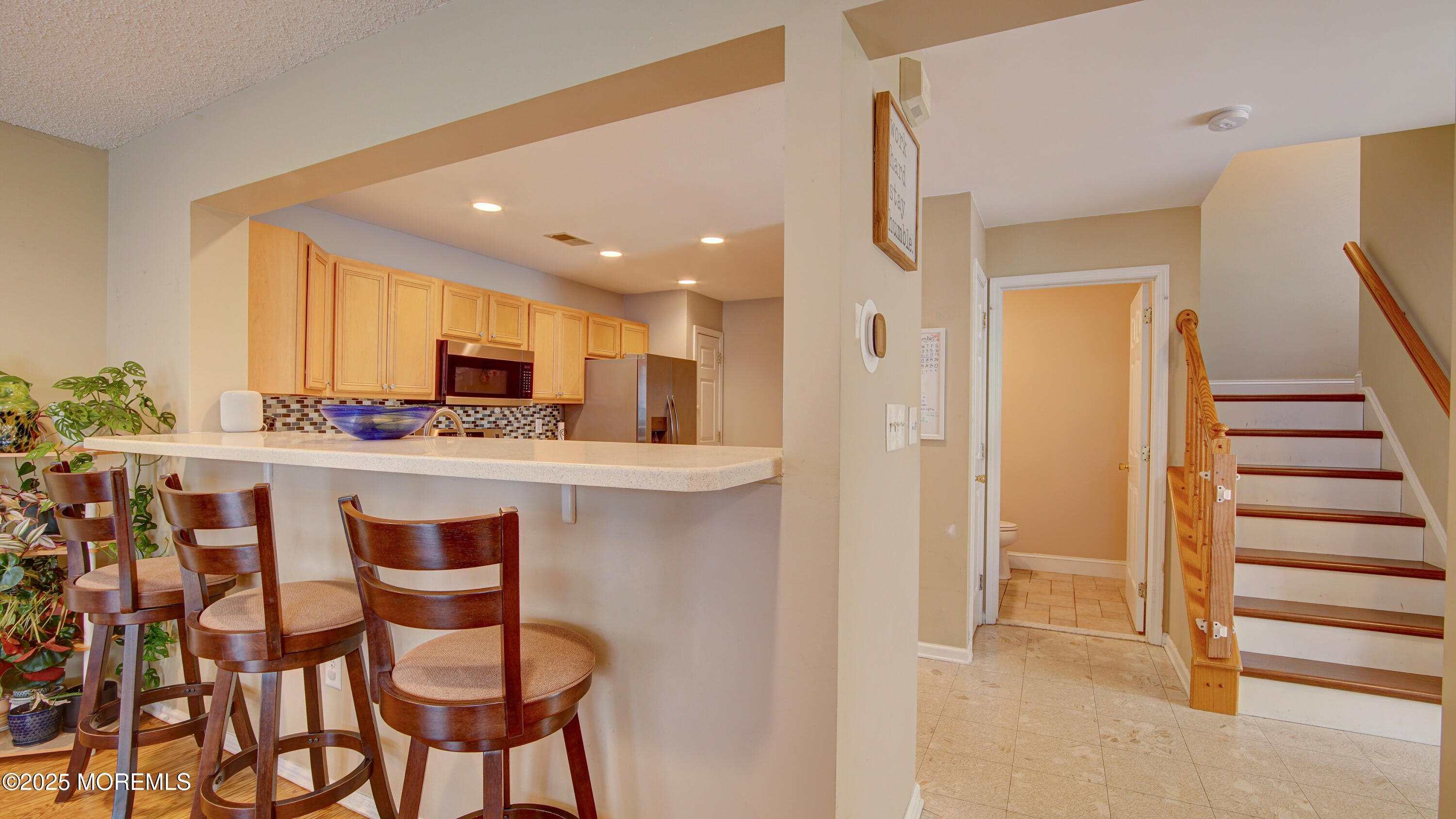 53 Winged Foot Court Howell, NJ 07731 - Photo 6 of 28 a kitchen with stainless steel appliances kitchen island granite countertop a refrigerator and cabinets