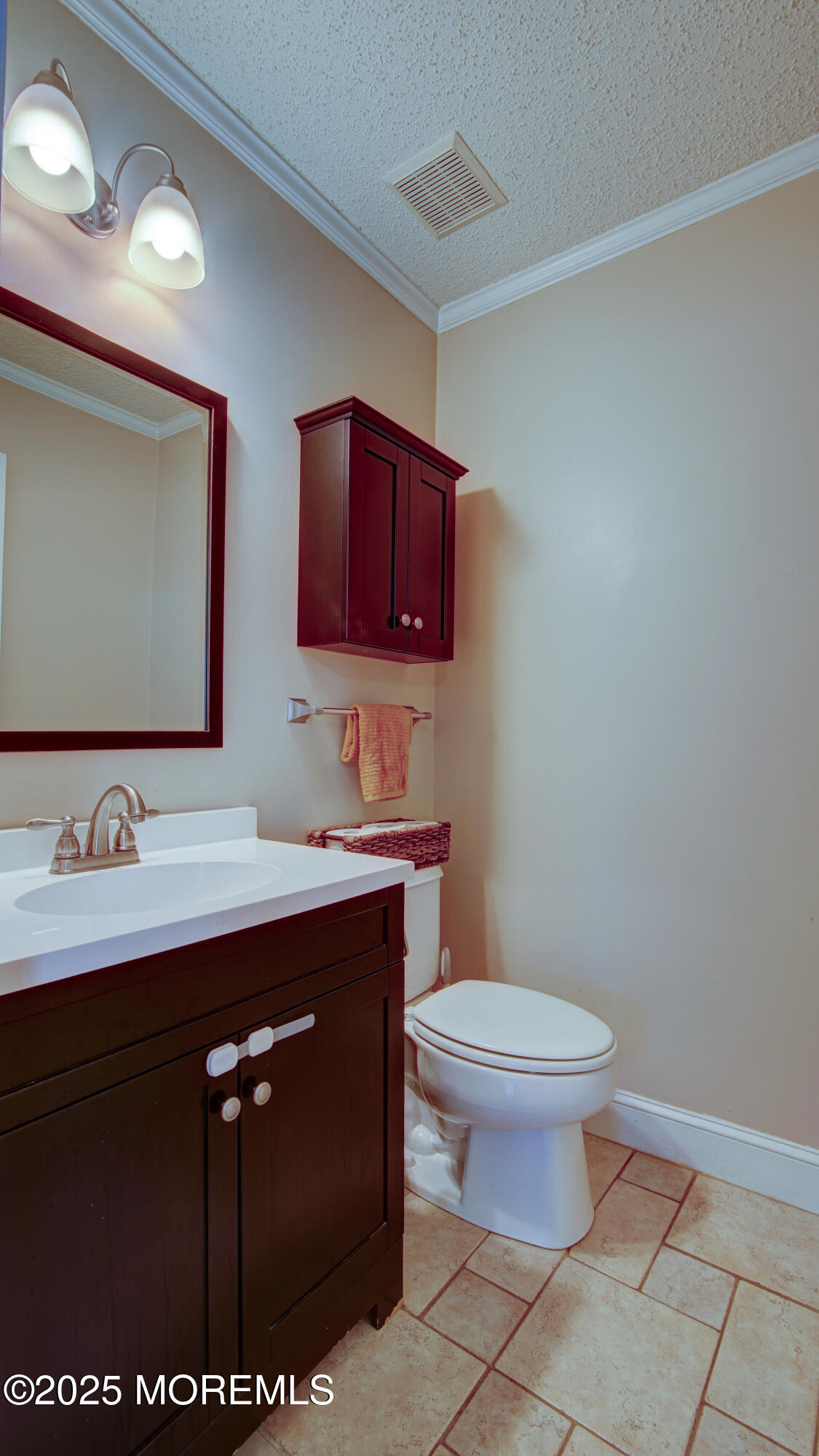 53 Winged Foot Court Howell, NJ 07731 - Photo 10 of 28 a bathroom with a toilet sink and mirror