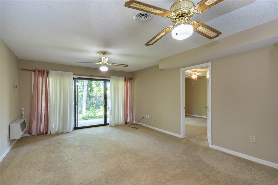 1302 Leeward Road Anderson, SC 29625 - Photo 33 of 50 A welcoming interior room with broad sliding glass doors opens to an inviting outdoor view.