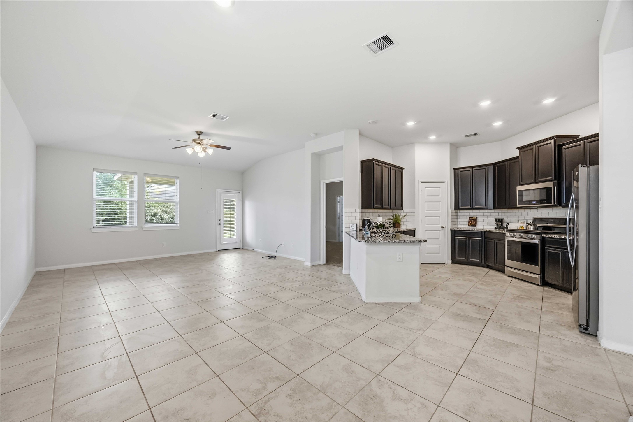 2425 Temple Crag Drive Rosharon, TX 77583 - Photo 5 of 32 Modern recessed lighting creates a bright, open, and welcoming atmosphere.