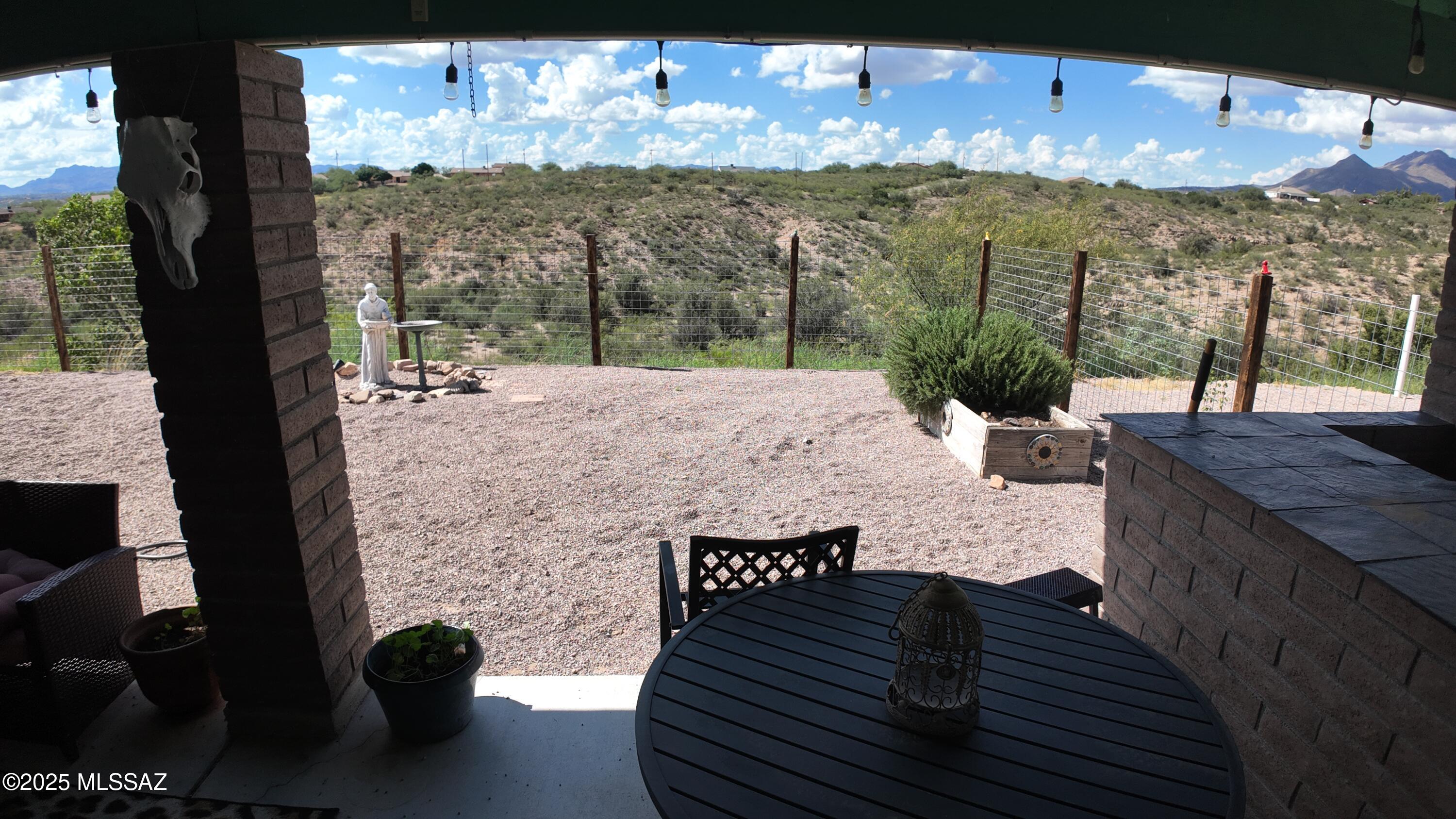 995 Jar Court Rio Rico, AZ 85648 - Photo 27 of 44 a view of a balcony with chair and table