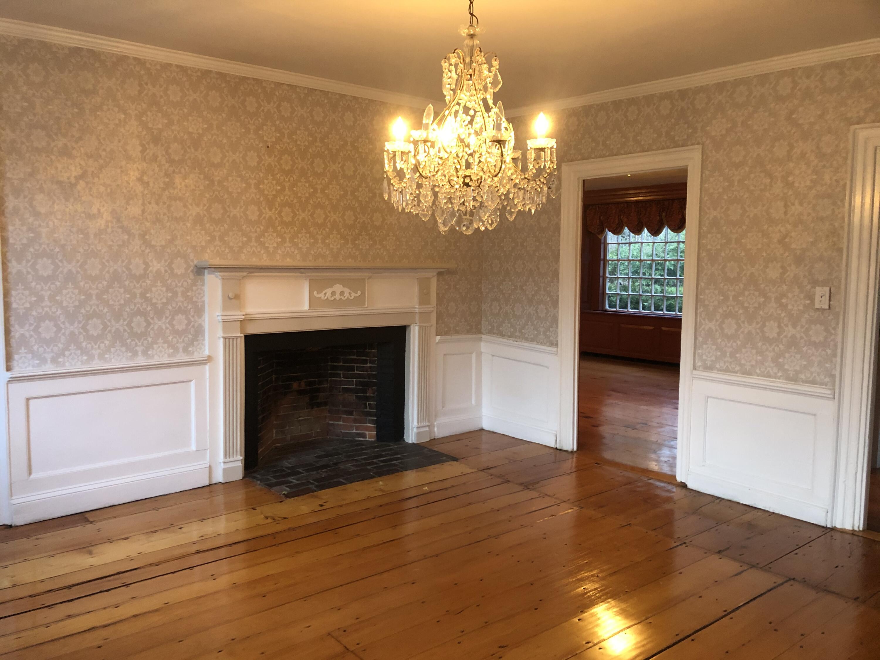132 Main Street Sandwich, MA 02563 - Photo 3 of 18 a view of a livingroom with a fireplace and window