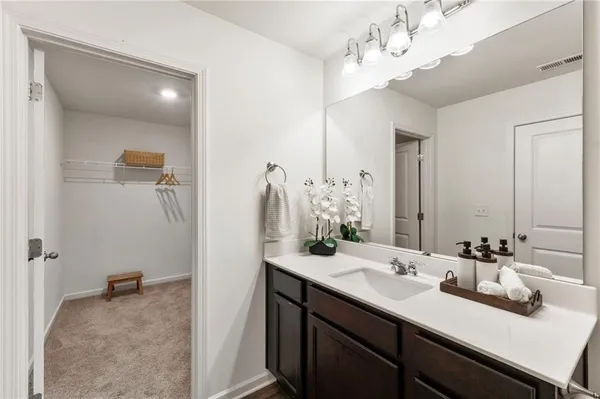 a bathroom with a sink double vanity and a mirror