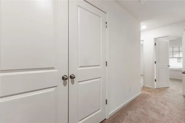a view of a hallway with closet