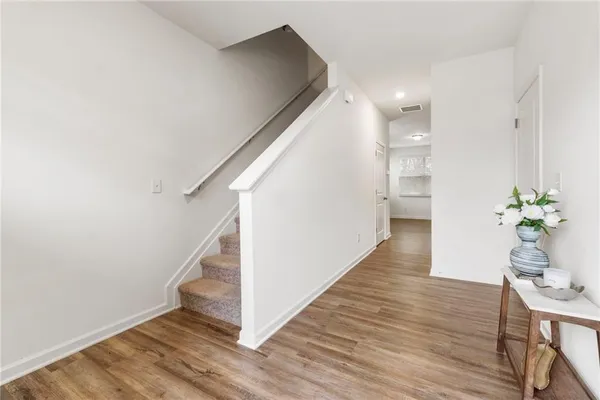 a view of entryway with wooden floor