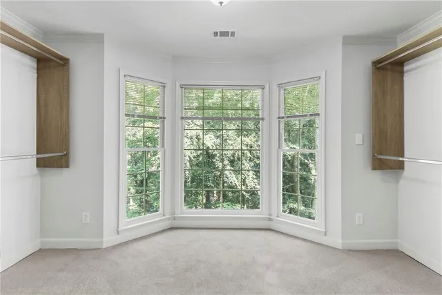 a view of a room with a large window
