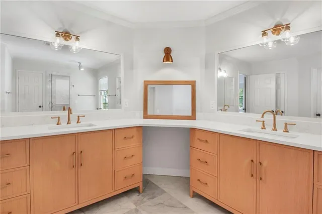 a bathroom with a double vanity sink and a mirror