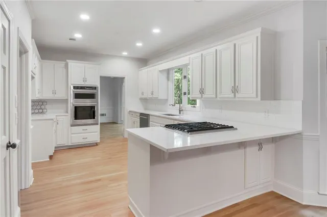 a kitchen with a stove and a sink