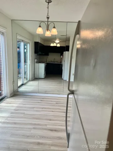 a view of a livingroom with a furniture wooden floor and window