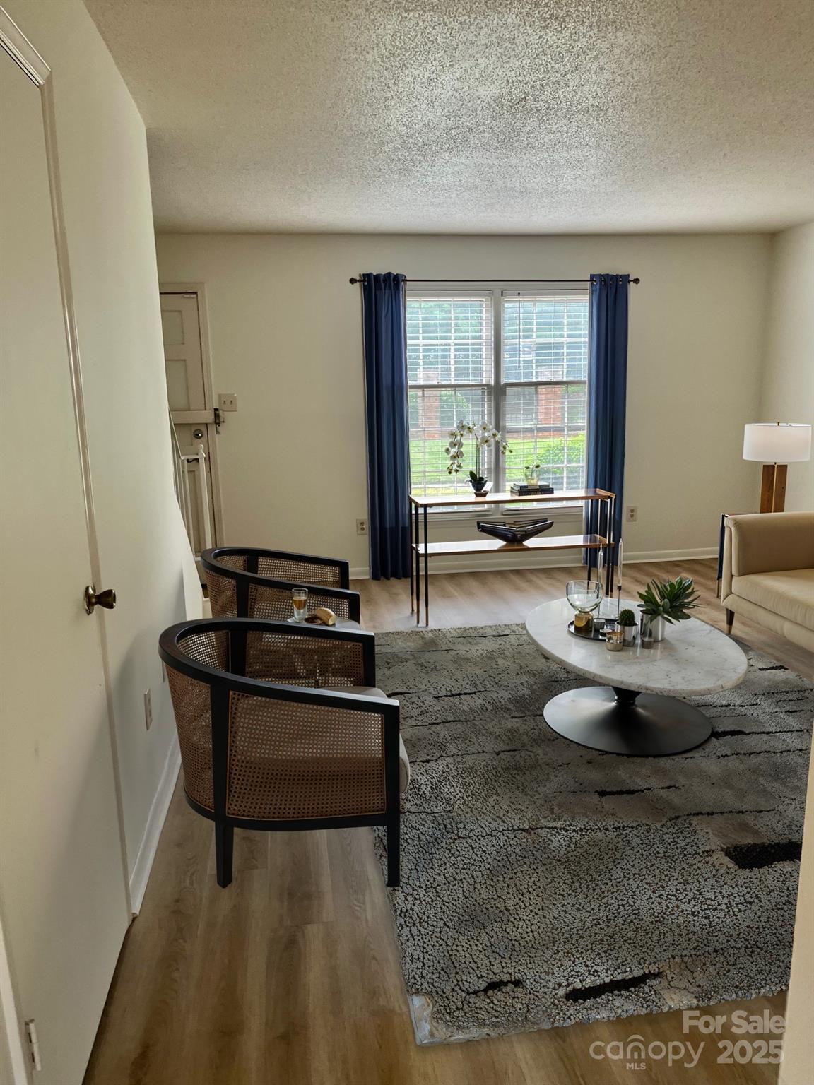 4520 Central Avenue, Unit C Charlotte, NC 28205 - Photo 4 of 18 a living room with furniture and a large window